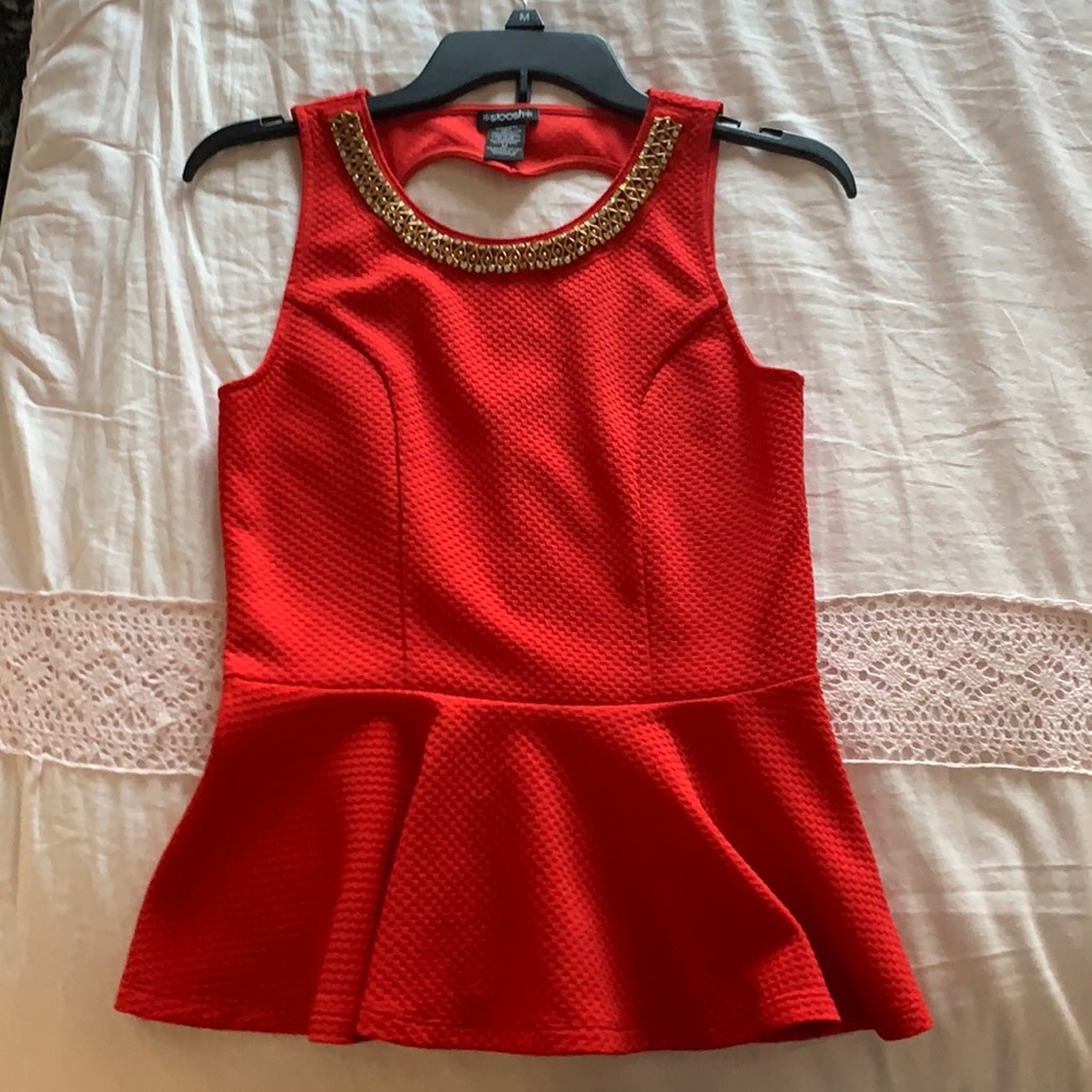 Red top with jewels on neckline